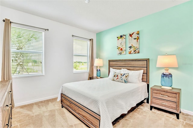 bedroom featuring light colored carpet