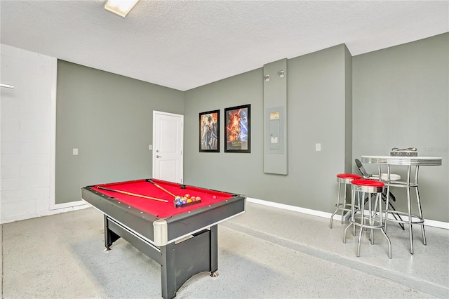 recreation room featuring a textured ceiling and pool table