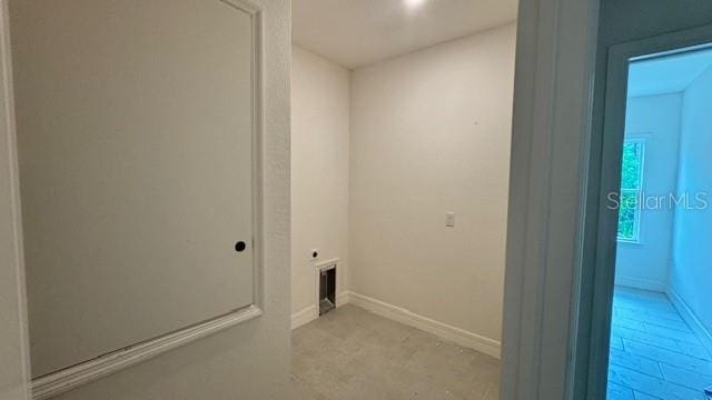 laundry room featuring laundry area, visible vents, and baseboards