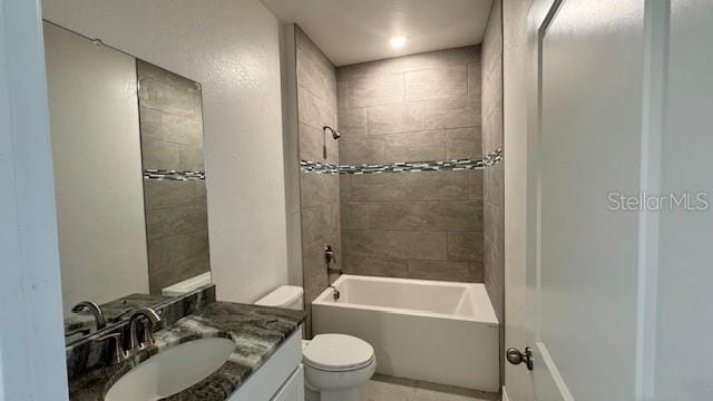 bathroom with shower / bath combination, vanity, and toilet