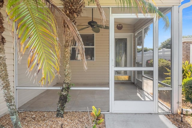 entrance to property featuring ceiling fan