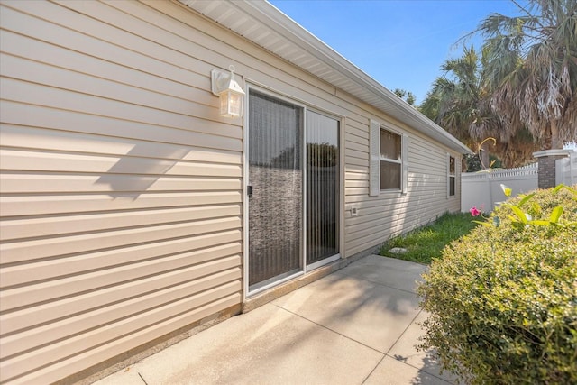 view of side of home with a patio area