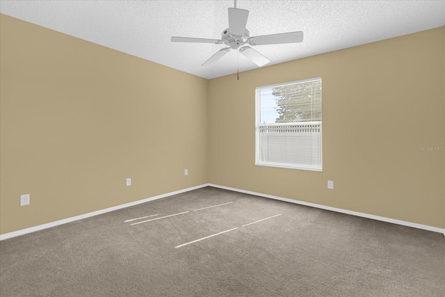 carpeted empty room with a textured ceiling and ceiling fan