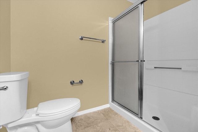 bathroom with walk in shower, tile flooring, and toilet