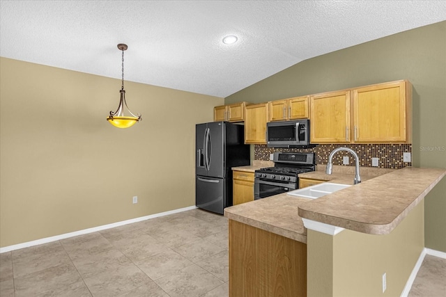 kitchen featuring backsplash, hanging light fixtures, appliances with stainless steel finishes, and kitchen peninsula