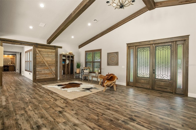 entrance foyer featuring beamed ceiling, dark hardwood / wood-style floors, high vaulted ceiling, and a barn door