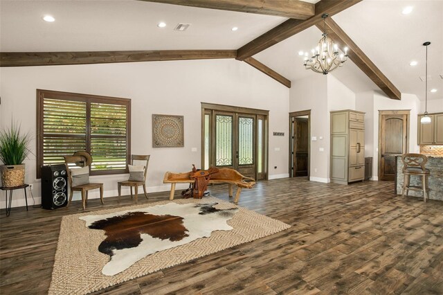 living room with high vaulted ceiling, dark hardwood / wood-style floors, and a chandelier