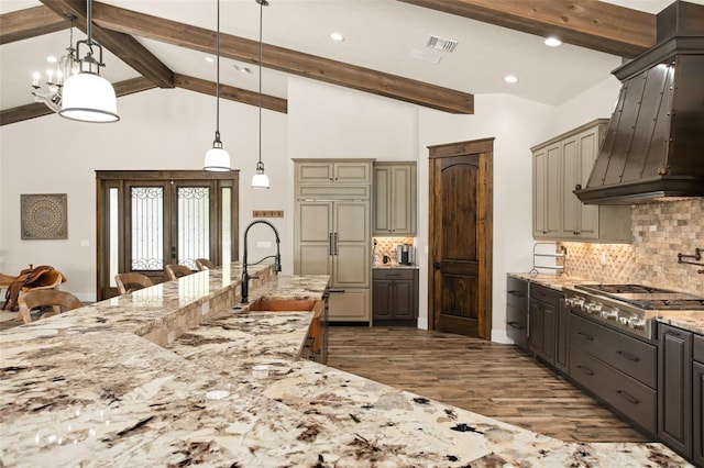 kitchen with french doors, pendant lighting, dark hardwood / wood-style flooring, premium range hood, and a notable chandelier