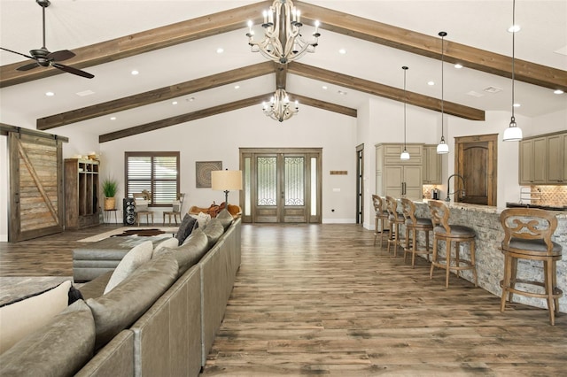 living room featuring beamed ceiling, high vaulted ceiling, ceiling fan with notable chandelier, and hardwood / wood-style flooring