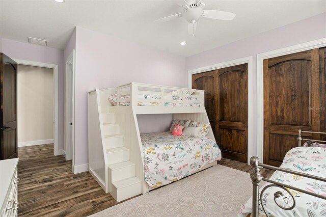 bedroom with a closet, ceiling fan, and dark hardwood / wood-style flooring