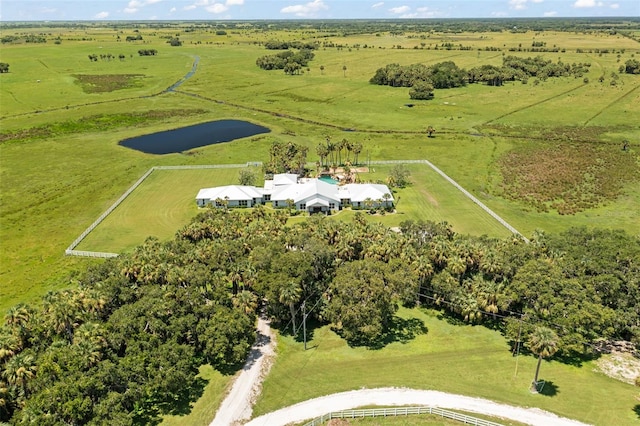 birds eye view of property with a rural view