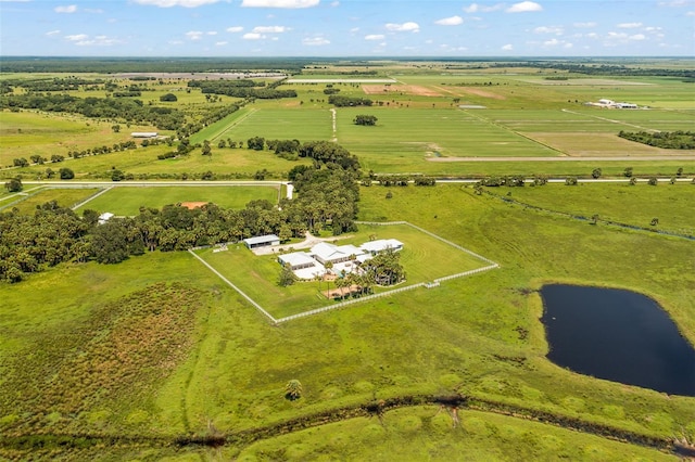 aerial view with a rural view and a water view