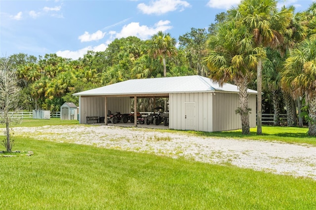 view of shed / structure featuring a lawn