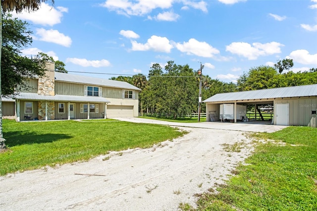 view of front facade featuring a front lawn and a garage