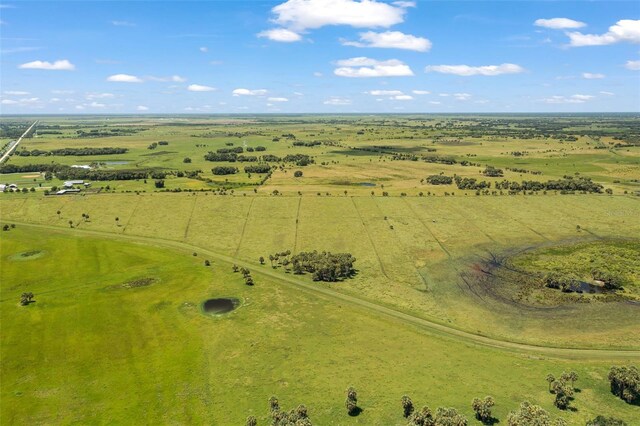 birds eye view of property with a rural view