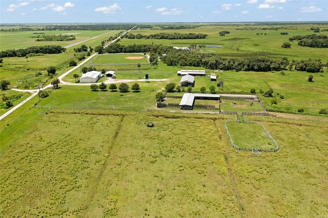 birds eye view of property featuring a rural view