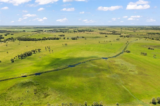 birds eye view of property featuring a rural view