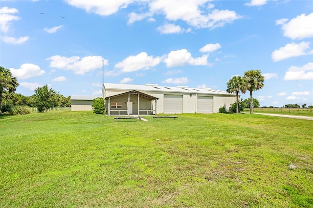 manufactured / mobile home with a front lawn and a garage