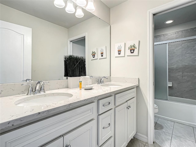 full bathroom featuring enclosed tub / shower combo, toilet, tile floors, and dual vanity