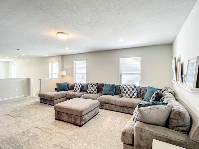 living room with light carpet and a textured ceiling