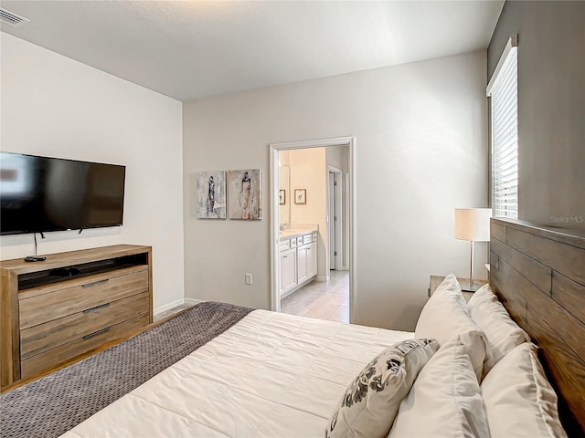 tiled bedroom with ensuite bathroom