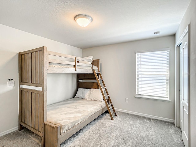 carpeted bedroom featuring multiple windows