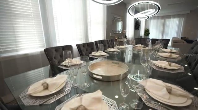 dining area featuring a chandelier