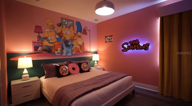 bedroom featuring dark hardwood / wood-style flooring