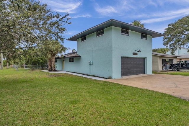 view of property exterior featuring a lawn and a garage