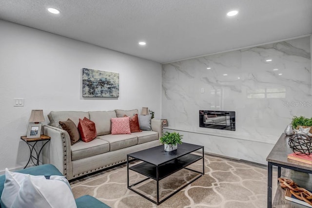 living room with a textured ceiling