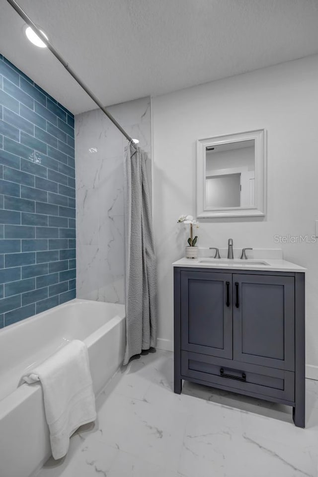 bathroom with tile floors, a textured ceiling, vanity, and shower / tub combo with curtain