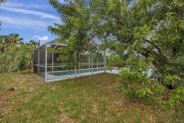 view of yard featuring a lanai