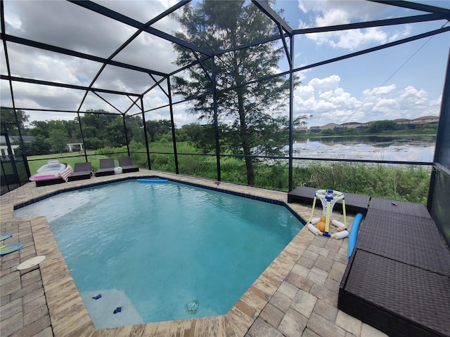 view of pool featuring a patio and glass enclosure