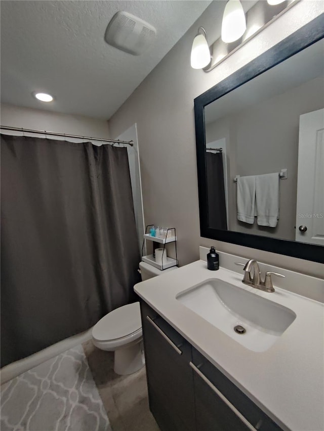 bathroom featuring toilet and oversized vanity