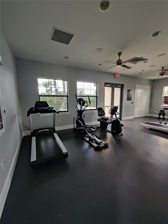 exercise room with ceiling fan