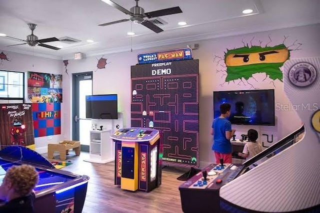 playroom featuring hardwood / wood-style floors, ceiling fan, and a healthy amount of sunlight