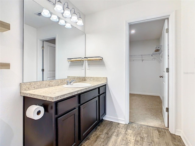 bathroom featuring wood-type flooring and vanity