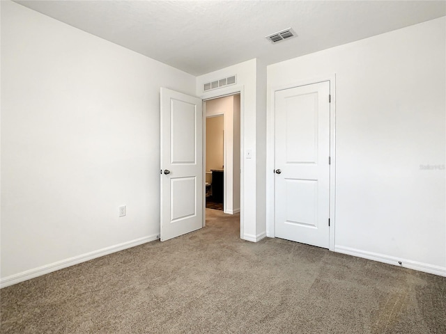 unfurnished bedroom featuring carpet flooring