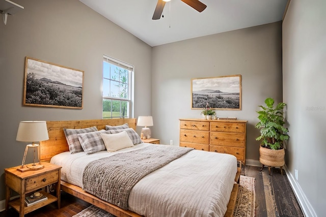 bedroom with lofted ceiling, ceiling fan, and dark wood-type flooring