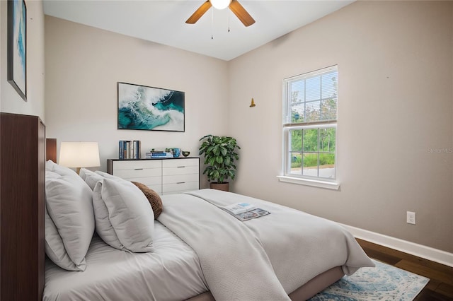 bedroom featuring ceiling fan and dark hardwood / wood-style floors