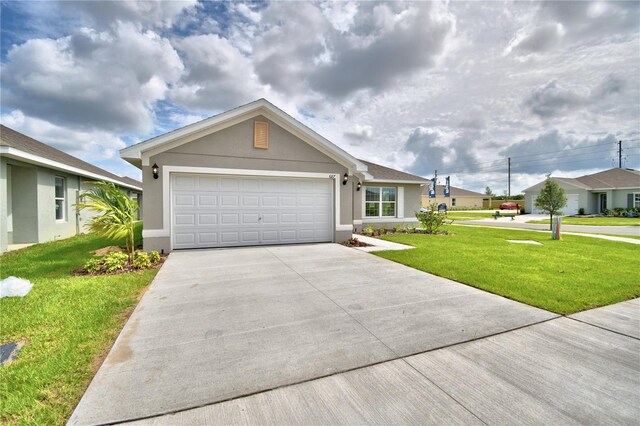 ranch-style home featuring a front lawn and a garage