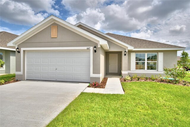 ranch-style home featuring a front lawn and a garage