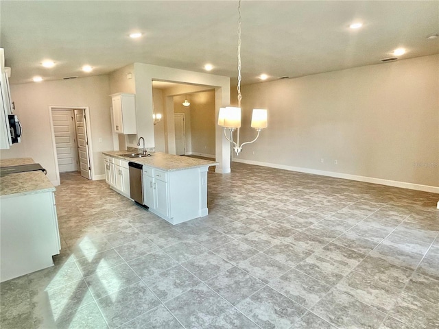 kitchen featuring light tile floors, decorative light fixtures, appliances with stainless steel finishes, white cabinets, and sink