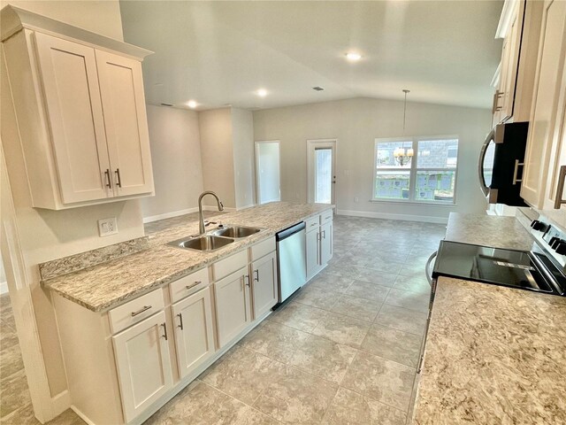 kitchen with white cabinetry, stainless steel appliances, sink, and light tile floors