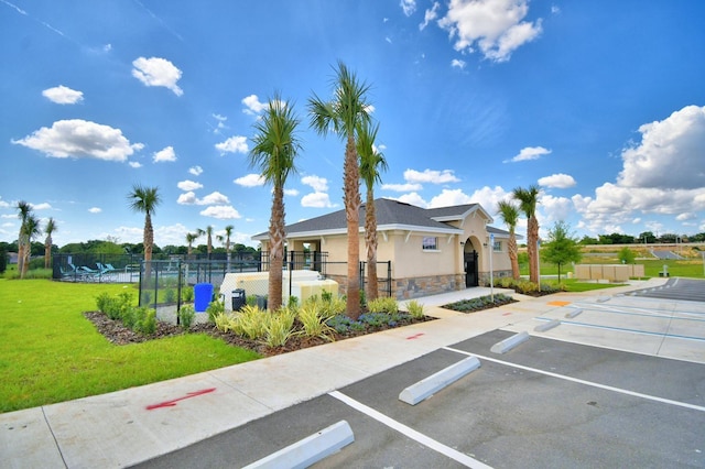 view of car parking featuring a yard