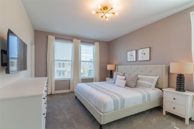 carpeted bedroom with an inviting chandelier