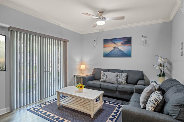 living room with ornamental molding, dark hardwood / wood-style flooring, and ceiling fan