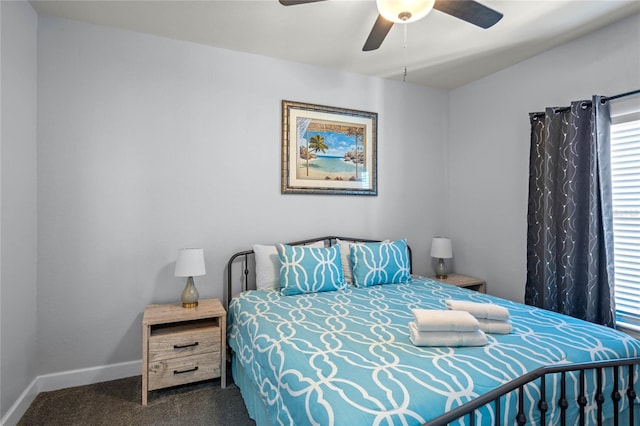 bedroom with dark carpet and ceiling fan