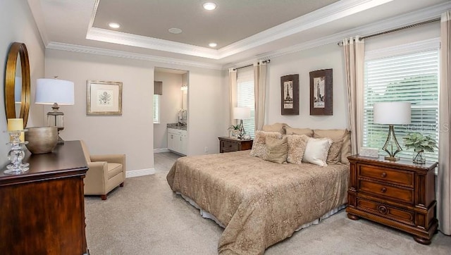 carpeted bedroom featuring crown molding and a raised ceiling