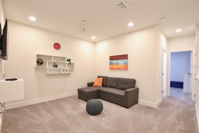 living area featuring light colored carpet